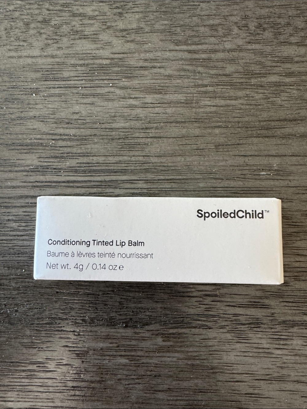 New in box SpoiledChild Conditioning Tinted Lip Balm - plum colored